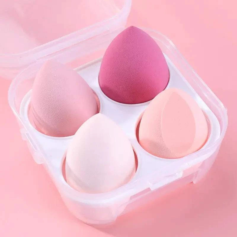 4pcs makeup sponge set in diverse roze tinten voor vlekkeloze foundation en poeder applicatie in transparante opbergdoos