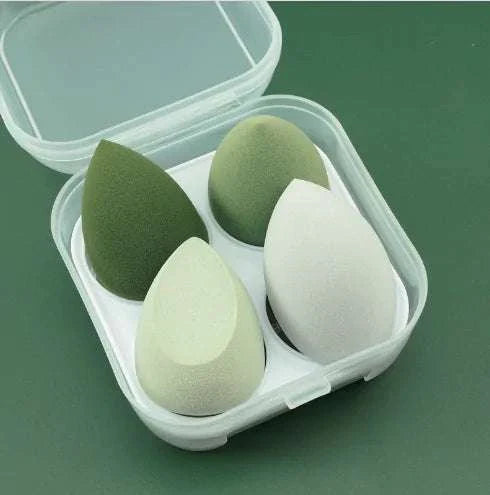 Set of 4 makeup sponge powder puffs in green and white shades for dry and wet applications in a plastic case