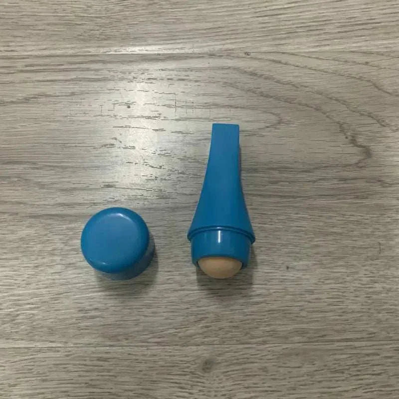 Mini volcanic stone facial cleansing ball with blue reusable cover for oily skin and oil absorption.