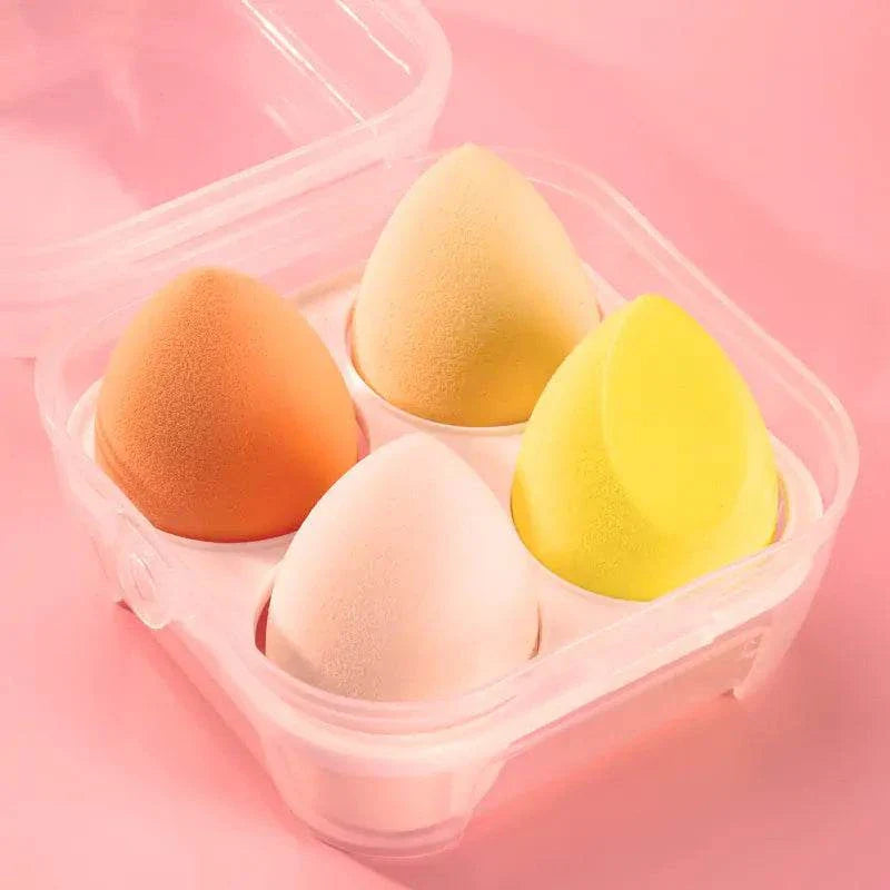 Set of 4 colorful makeup sponge powder puffs in a transparent case for dry and wet application