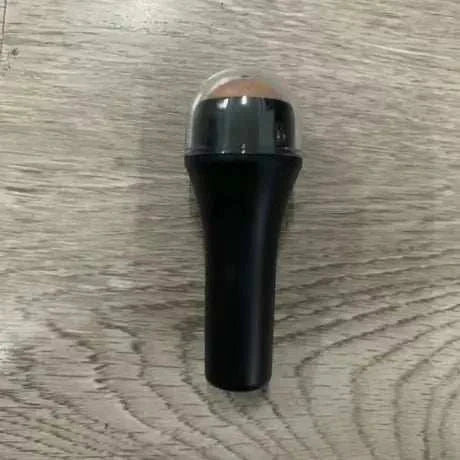 Mini volcanic stone facial cleansing ball with black handle for oily skin and oil absorption