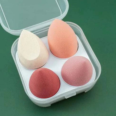 Set of 4 makeup sponge powder puffs in assorted colors for dry and wet application in a clear plastic case